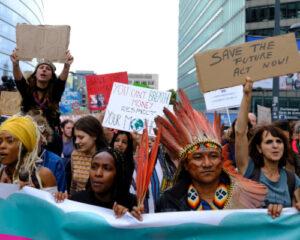 Members of an indigenous delegation from Brazil take part in the Walk for Your Future climate march ahead of COP27 in Brussels, Belgium on October 23, 2022.