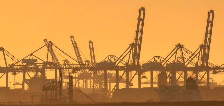Hazy yellow skyline of oil refinery
